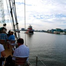 American Rover Passing a Tug Boat